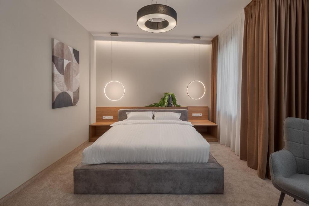 Postel nebo postele na pokoji v ubytování Oasis Rooms