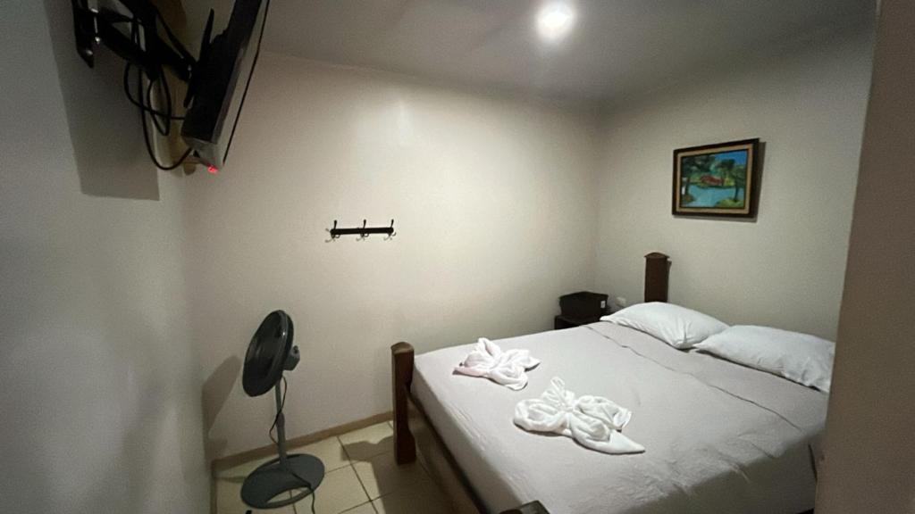 Postel nebo postele na pokoji v ubytování Rivera Family Airport Apartments