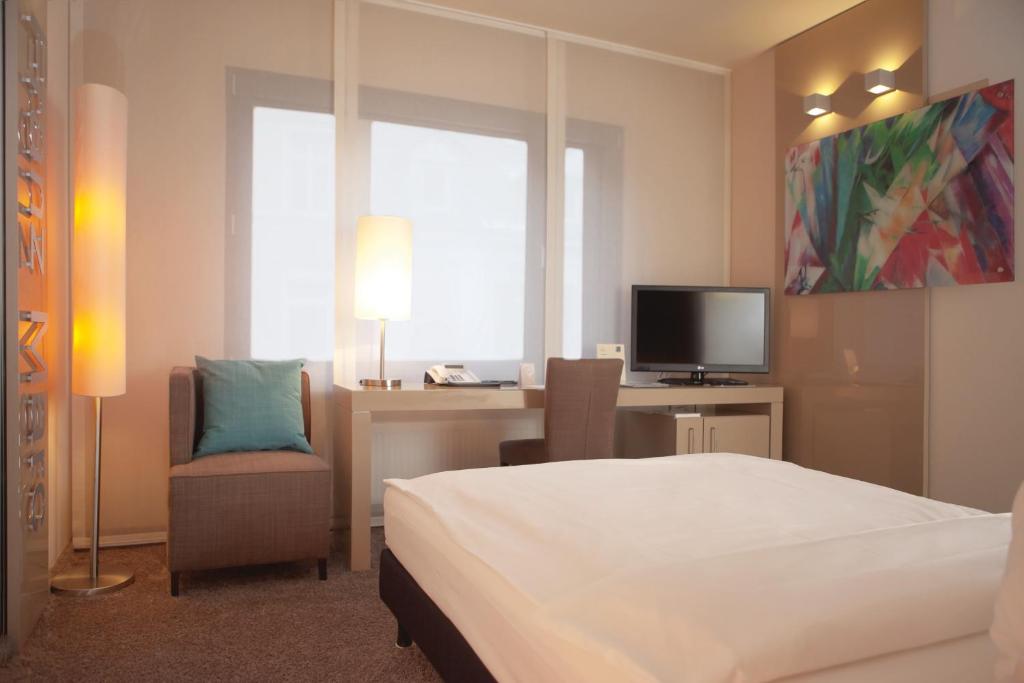 TV a/nebo společenská místnost v ubytování Hotel Der Blaue Reiter