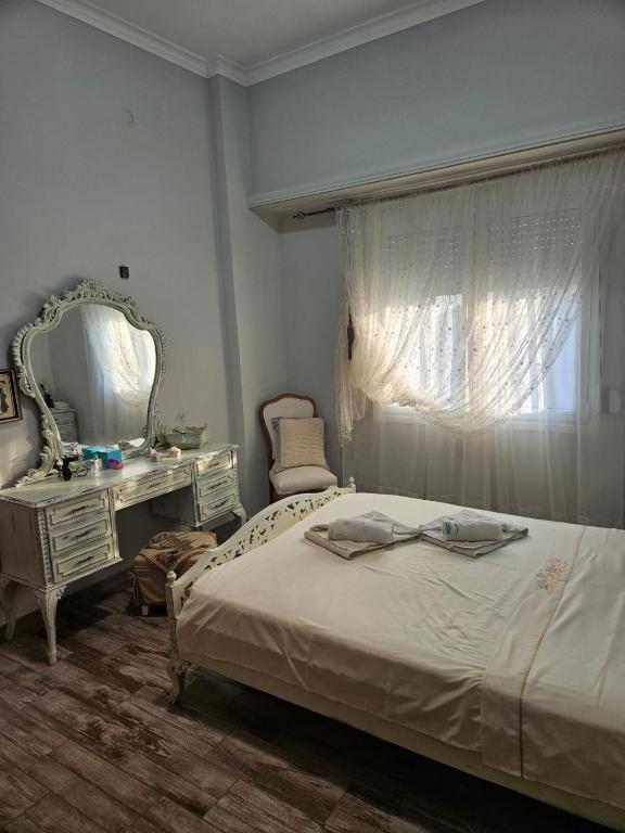 Postel nebo postele na pokoji v ubytování ΜΑΡΙΑ η ΧΑΛΚΙΔΕΑ