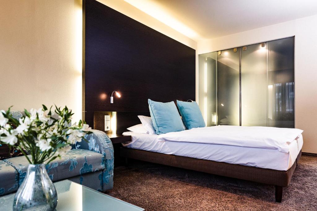 Postel nebo postele na pokoji v ubytování Hotel Der Blaue Reiter