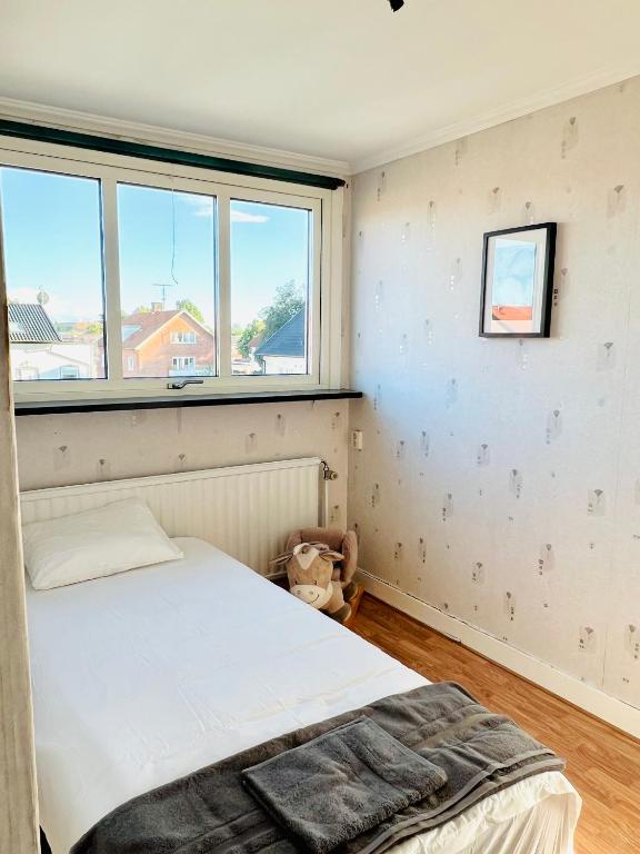 Postel nebo postele na pokoji v ubytování CozyHouse