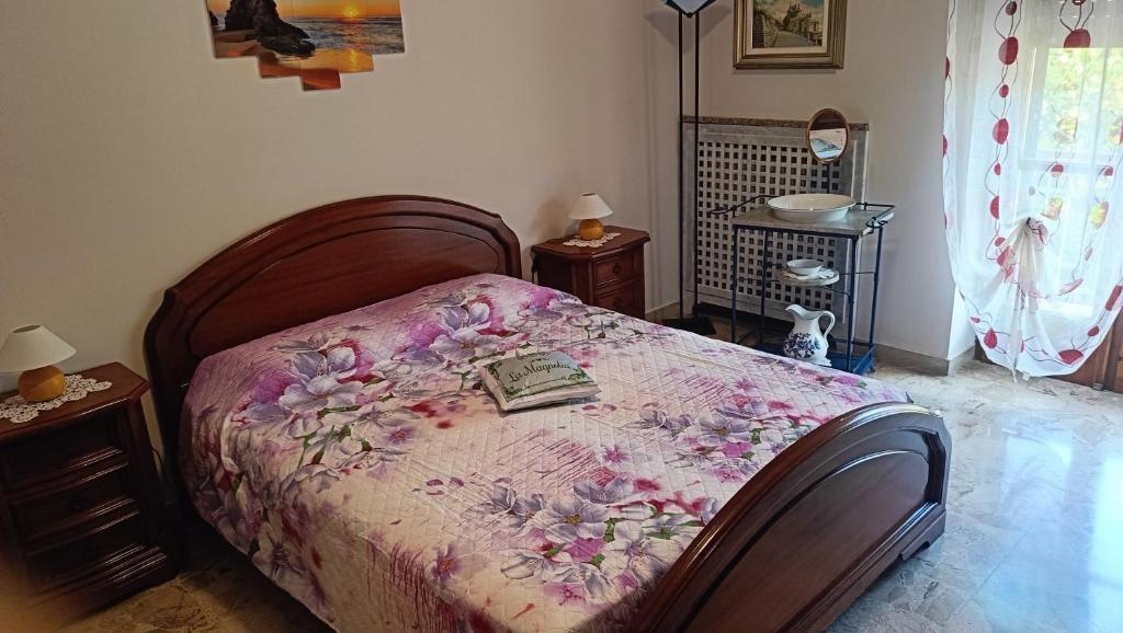 Łóżko lub łóżka w pokoju w obiekcie La Magnolia B&B