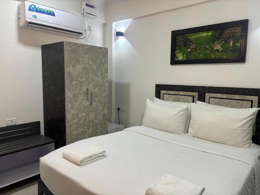 Postel nebo postele na pokoji v ubytování Henmil Hotel