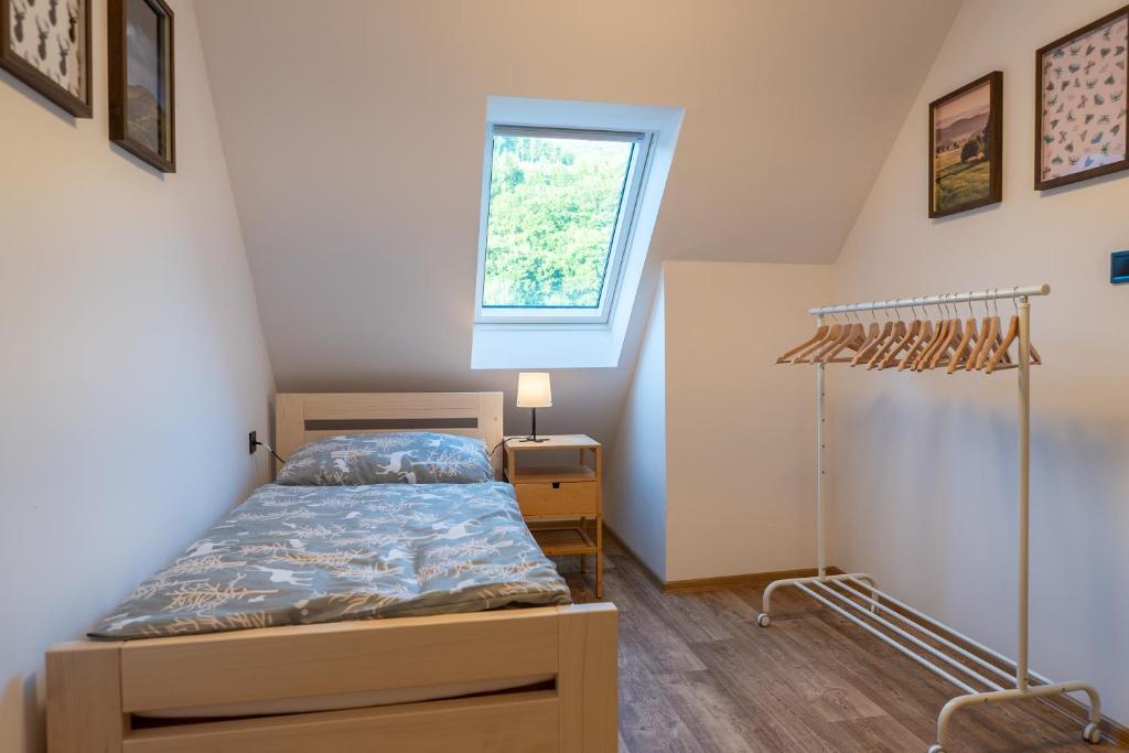 Postel nebo postele na pokoji v ubytování Koliba Pod Horů
