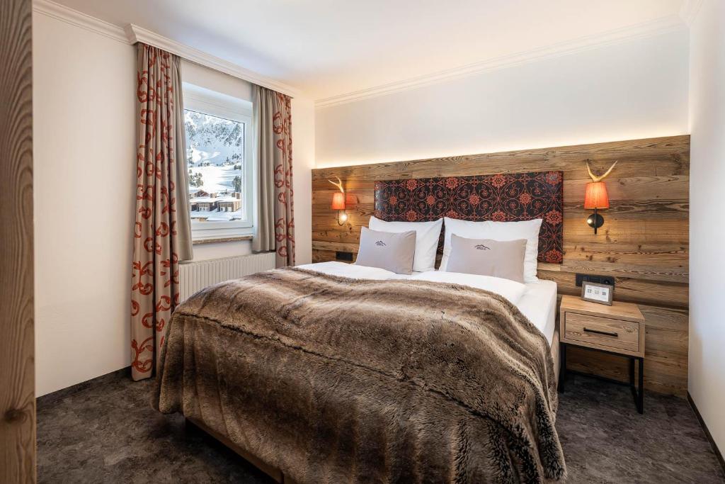 Postel nebo postele na pokoji v ubytování Hotel Zehnerkar & Hotel Obertauern