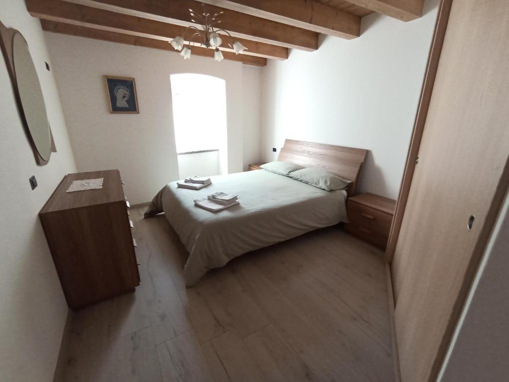 Postel nebo postele na pokoji v ubytování Appartamento Lorena a Mezzano