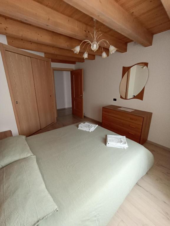 Postel nebo postele na pokoji v ubytování Appartamento Lorena a Mezzano