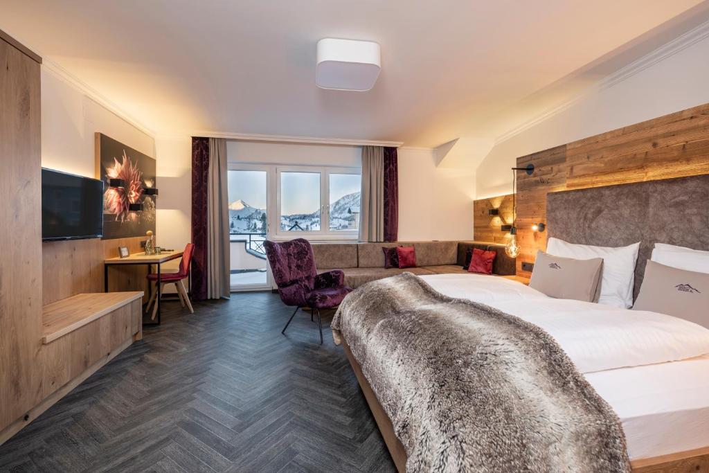 Postel nebo postele na pokoji v ubytování Hotel Zehnerkar & Hotel Obertauern