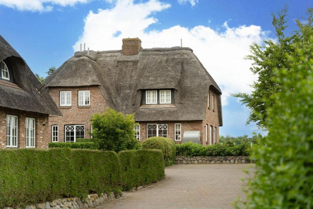 Zahrada ubytování Seesucht-Föhr - Moderne Reet-Haushälfte mit Sauna, Garten & Terrasse nahe Wattenmeer