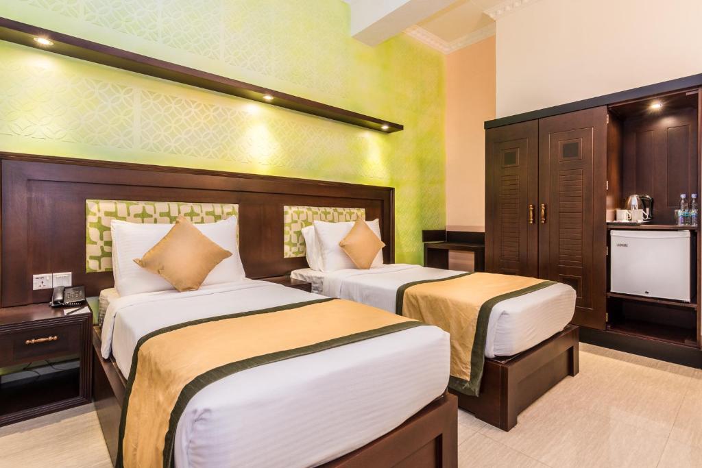 Postel nebo postele na pokoji v ubytování Mount Best Hotel- Mount Lavinia