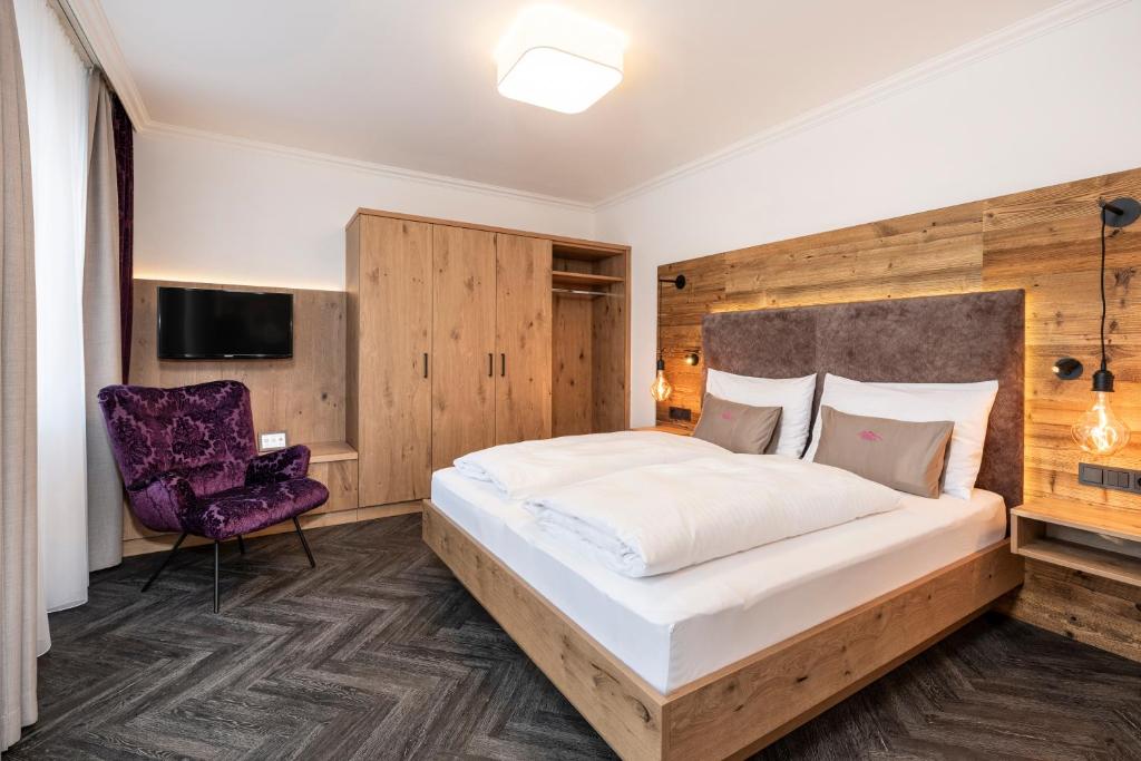 Postel nebo postele na pokoji v ubytování Hotel Zehnerkar & Hotel Obertauern