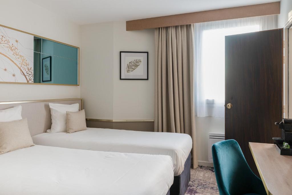 Postel nebo postele na pokoji v ubytování Brit Hotel Orléans St Jean de Braye - L'Antarès