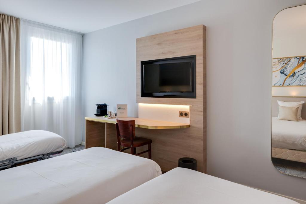 Postel nebo postele na pokoji v ubytování Brit Hotel Orléans St Jean de Braye - L'Antarès