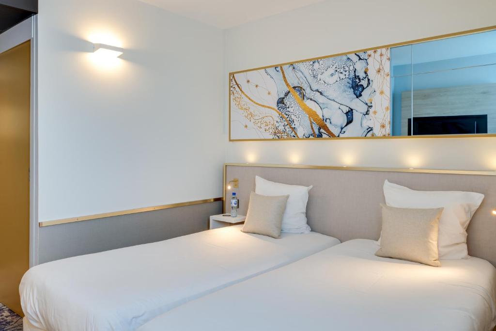 Postel nebo postele na pokoji v ubytování Brit Hotel Orléans St Jean de Braye - L'Antarès