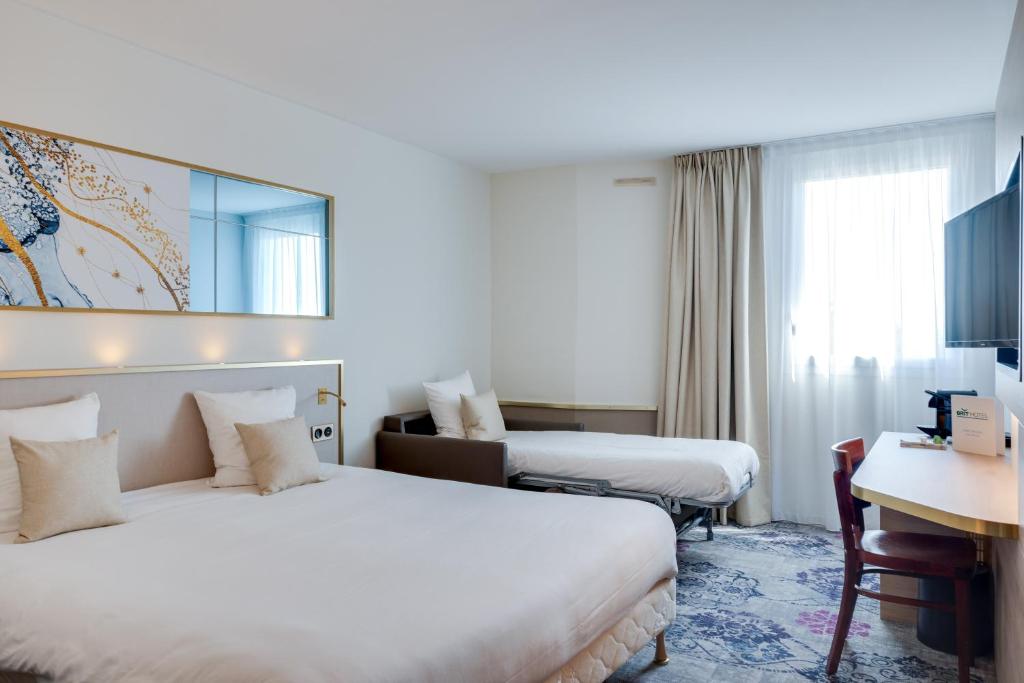 Postel nebo postele na pokoji v ubytování Brit Hotel Orléans St Jean de Braye - L'Antarès