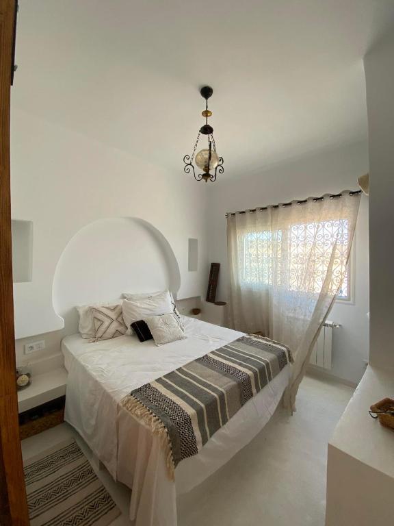Postel nebo postele na pokoji v ubytování artgohomes