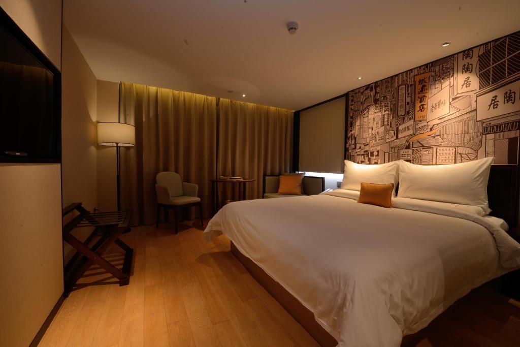 Postel nebo postele na pokoji v ubytování Guangzhou City Join Hotel Shipai Qiao metro Branch