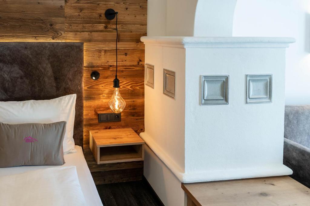 Postel nebo postele na pokoji v ubytování Hotel Zehnerkar & Hotel Obertauern