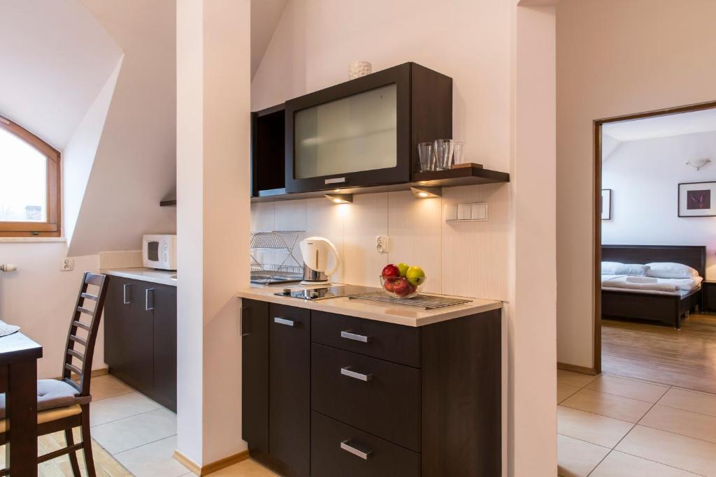Kuchyňa alebo kuchynka v ubytovaní udanypobyt Apartament z Basenem