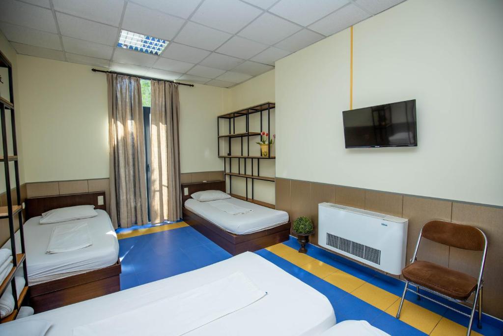 Postel nebo postele na pokoji v ubytování Formula 1 Motel