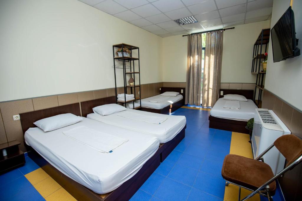 Postel nebo postele na pokoji v ubytování Formula 1 Motel