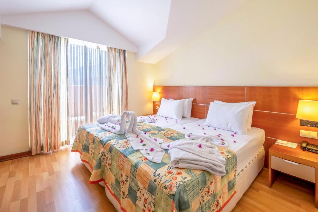 Postel nebo postele na pokoji v ubytování Viking Park Hotel