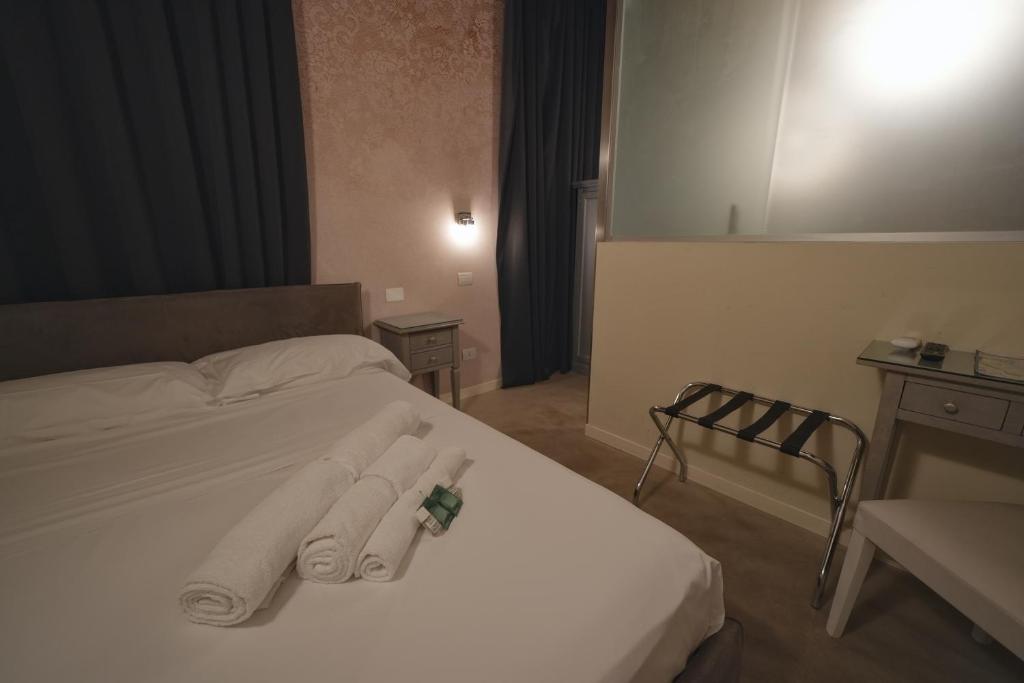 Postel nebo postele na pokoji v ubytování Palazzo di Giulietta - Juliet's Palace Verona
