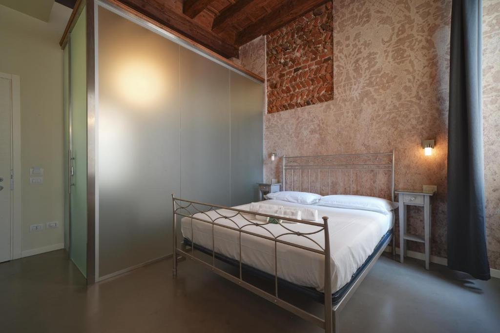 Postel nebo postele na pokoji v ubytování Palazzo di Giulietta - Juliet's Palace Verona