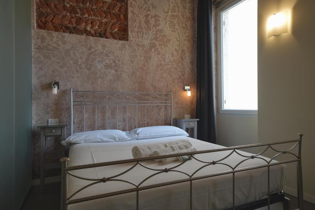 Postel nebo postele na pokoji v ubytování Palazzo di Giulietta - Juliet's Palace Verona