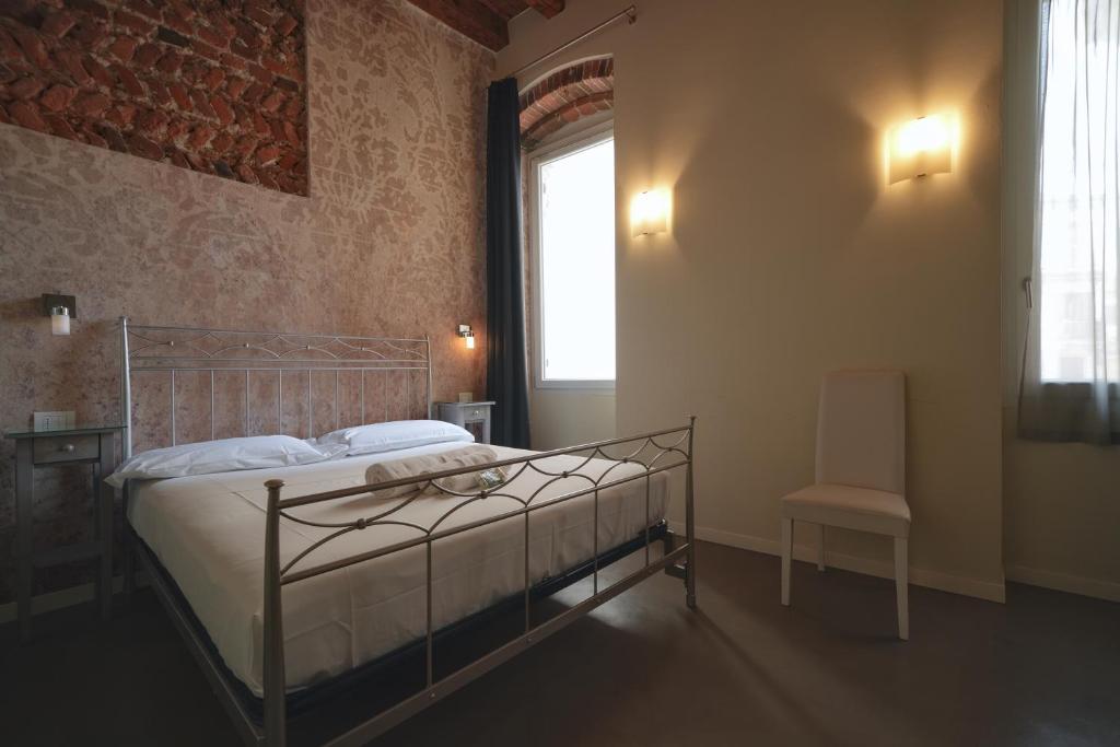 Postel nebo postele na pokoji v ubytování Palazzo di Giulietta - Juliet's Palace Verona