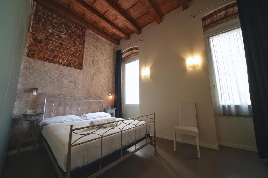 Postel nebo postele na pokoji v ubytování Palazzo di Giulietta - Juliet's Palace Verona