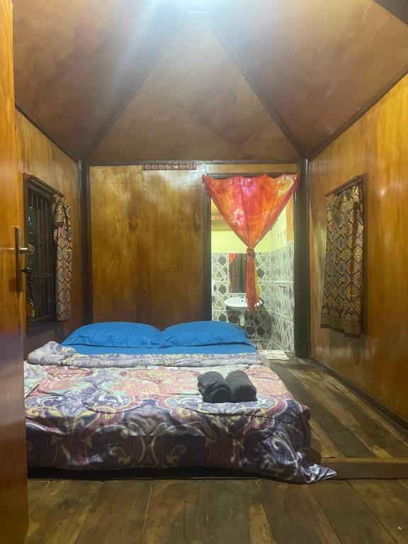 Postel nebo postele na pokoji v ubytování Sky garden Lombok