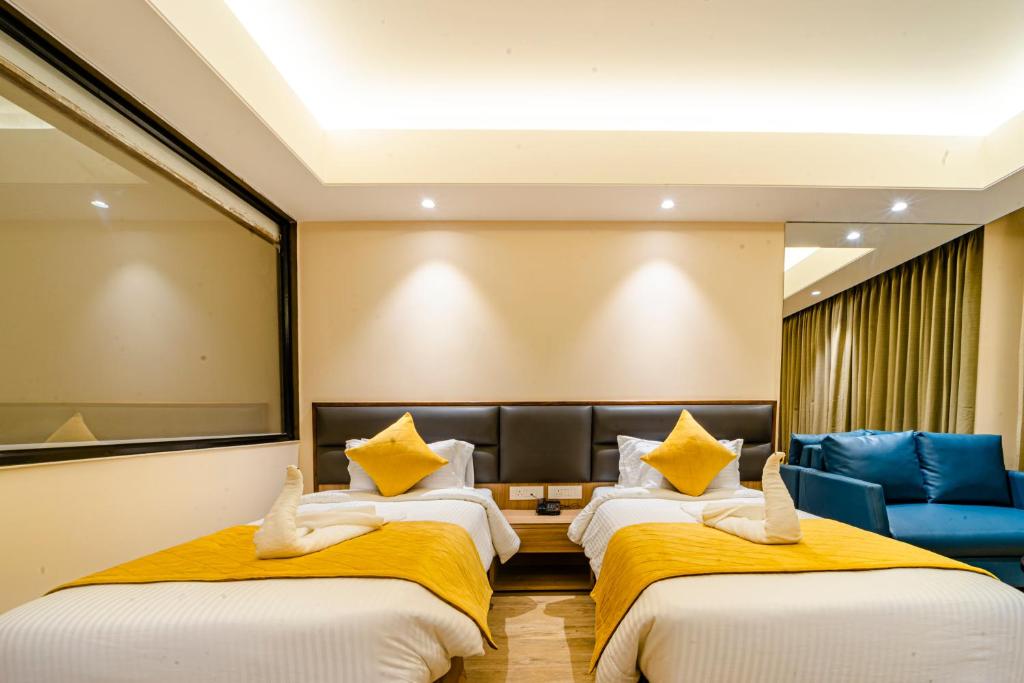 Postel nebo postele na pokoji v ubytování Hotel Palacio Regency