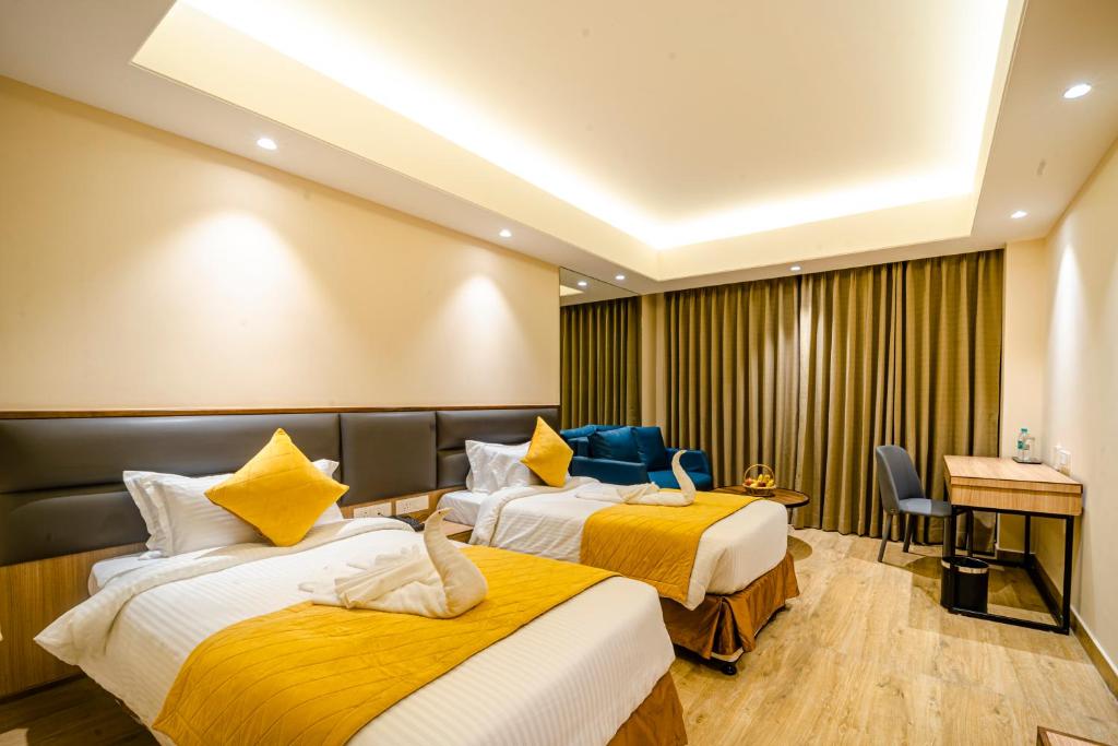 Postel nebo postele na pokoji v ubytování Hotel Palacio Regency