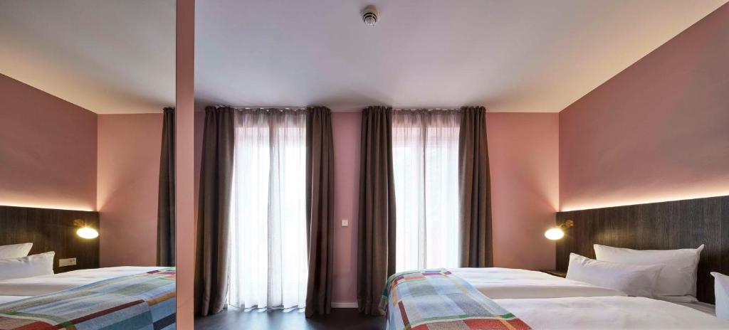Postel nebo postele na pokoji v ubytování Central Hotel Münster