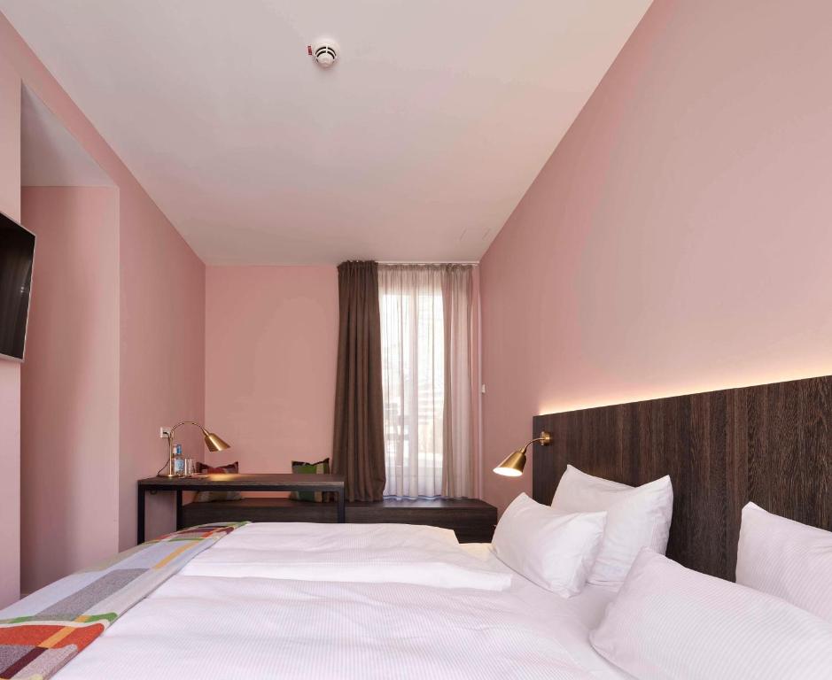 Postel nebo postele na pokoji v ubytování Central Hotel Münster