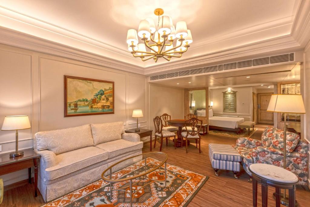 a living room with a couch and a table at Namah Nainital, a member of Radisson Individuals Retreats in Nainital