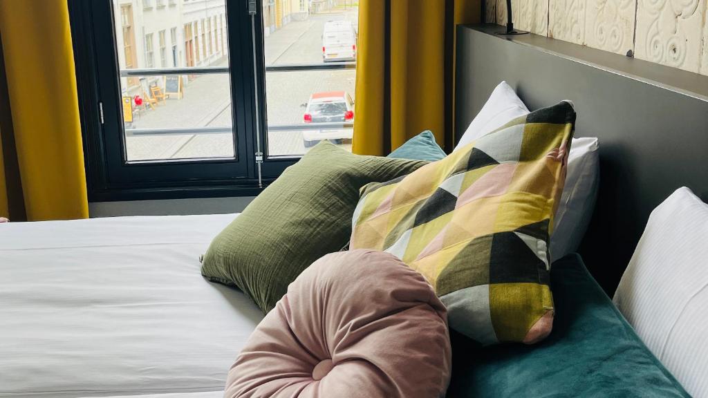 Postel nebo postele na pokoji v ubytování Hotel Sutor