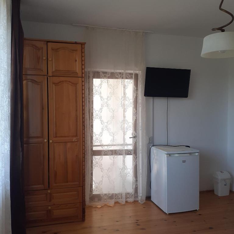 TV a/nebo společenská místnost v ubytování Guest House Sun