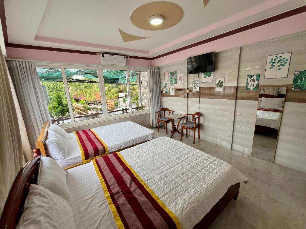 Giường trong phòng chung tại T'H Homestay