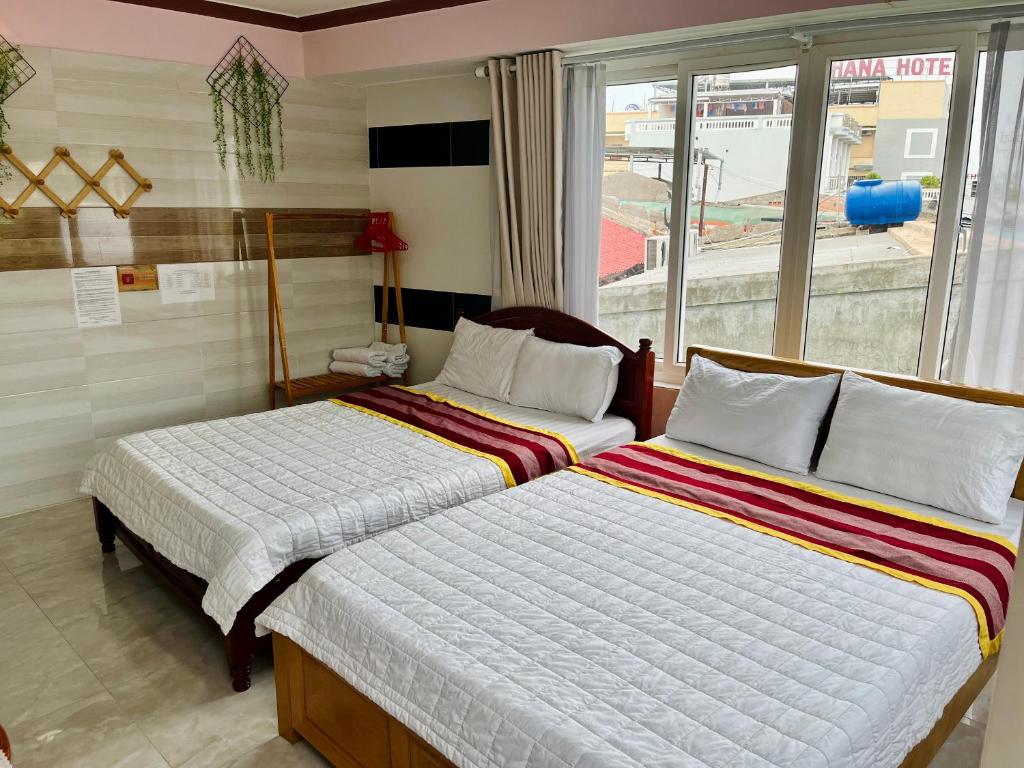 Giường trong phòng chung tại T'H Homestay