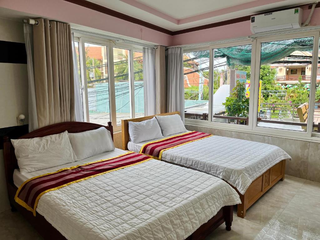 Giường trong phòng chung tại T'H Homestay