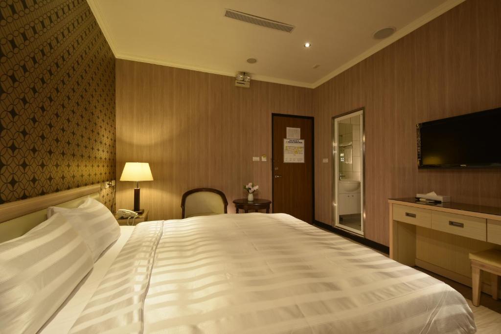 Postel nebo postele na pokoji v ubytování A casa Hotel