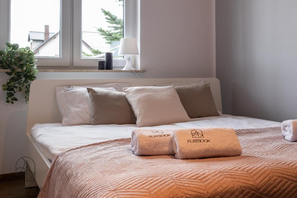 Postel nebo postele na pokoji v ubytování Apartamenty - Krynica Morska Gdańska
