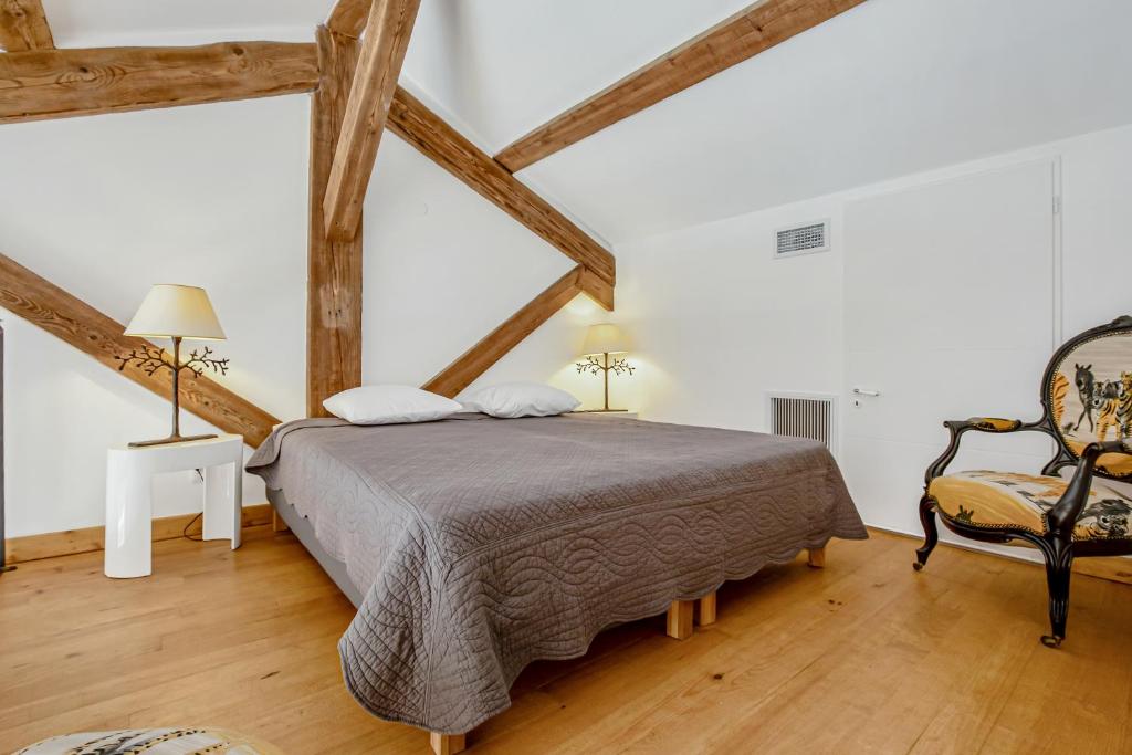 Postel nebo postele na pokoji v ubytování Château Hermitage de Combas