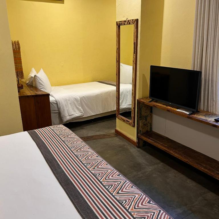 Postel nebo postele na pokoji v ubytování Bahiacafé Hotel