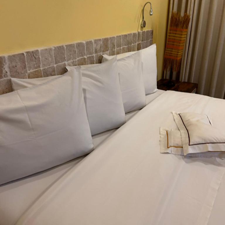 Postel nebo postele na pokoji v ubytování Bahiacafé Hotel