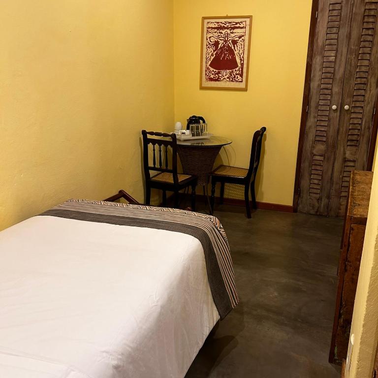 Postel nebo postele na pokoji v ubytování Bahiacafé Hotel