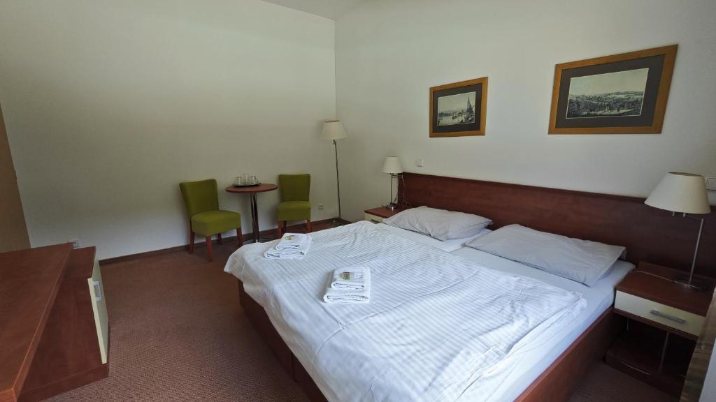Postel nebo postele na pokoji v ubytování Geyserpark Village